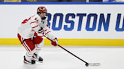 Boston University defenseman Cole Hutson skates with the puck in the first period against the Cornell.