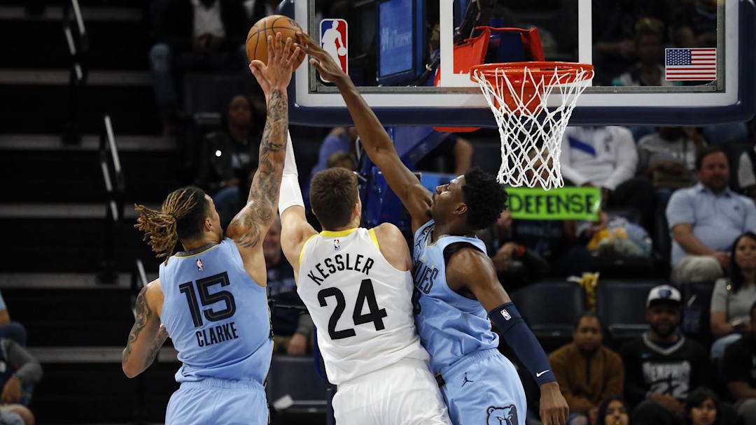 Feb 15, 2023; Memphis, Tennessee, USA; Memphis Grizzlies forward Jaren Jackson Jr. (13) blocks the shot of Utah Jazz center Walker Kessler (24) during the first half at FedExForum. Mandatory Credit: Petre Thomas-Imagn Images