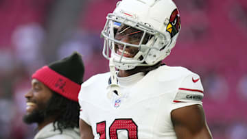 Arizona Cardinals receiver Marvin Harrison Jr. (18) smiles as the team takes the field to play the New England Patriots at State Farm Stadium on Dec. 15, 2024.