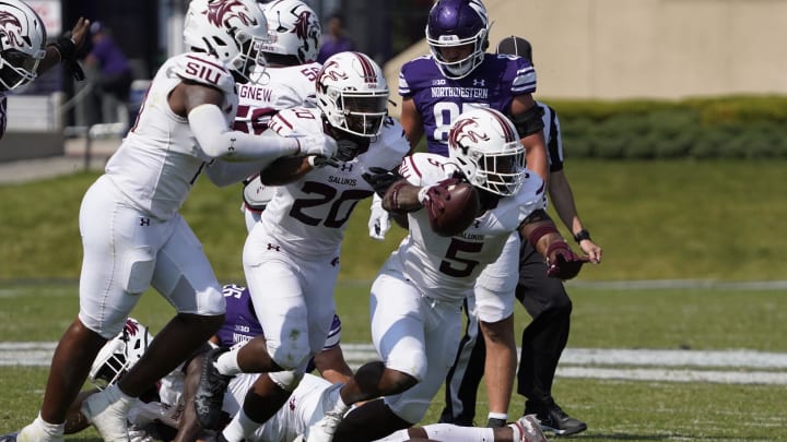 Sep 17, 2022; Evanston, Illinois, USA; Southern Illinois Salukis linebacker Chris Harris Jr. (5) celebrates a fumble recovery against the Northwestern Wildcats during the second half at Ryan Field.