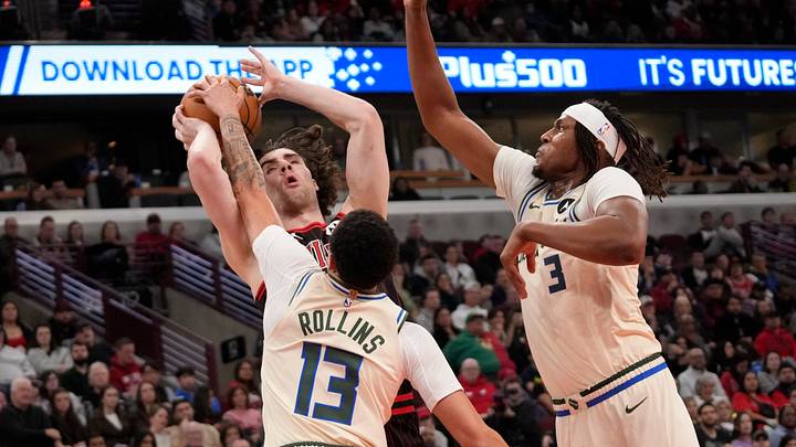 Dec 27, 2025; Chicago, Illinois, USA; Milwaukee Bucks center Myles Turner (3) guard Ryan Rollins (13) defend Chicago Bulls guard Josh Giddey (3) during the first half at United Center. Mandatory Credit: David Banks-Imagn Images