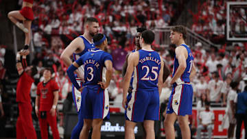 Feb 12, 2024; Lubbock, Texas, USA;  Kansas Jayhawks center Hunter Dickinson (1), in the second half along with forward KJ Adams Jr. (5), guard Johnny Furphy (10), guard Nicolas Timberlake (25) and guard Dajuan Harris Jr (3) in the game against the Texas Tech Red Raiders at United Supermarkets Arena. Mandatory Credit: Michael C. Johnson-Imagn Images