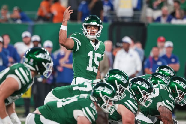 New York Jets quarterback Adrian Martinez signals during the first quarter against the New York Giants at MetLife Stadium