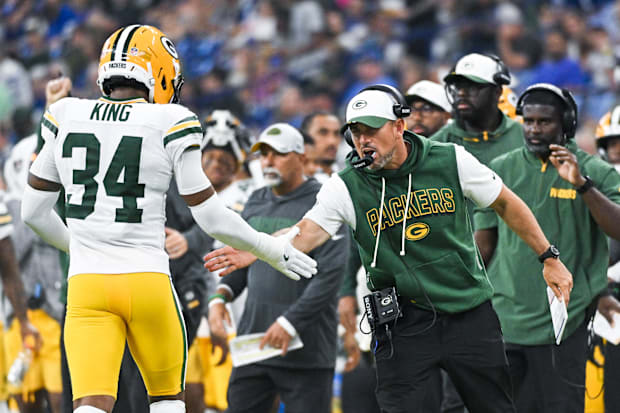 Green Bay Packers cornerback Kalen King high-fives coach Matt LaFleur during the first half against the Indianapolis Colts.