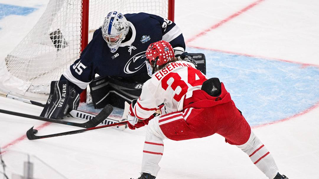 Apr 10, 2025; St. Louis, Missouri, UNITED STATES; Penn State Nittany Lions goaltender Arsenii Sergeev (35) defends the net against Boston University Terriers forward Cole Eiserman (34) during the third period of the Frozen Four college ice hockey national semifinals at Enterprise Center. Mandatory Credit: Connor Hamilton-Imagn Images