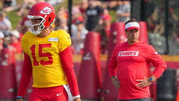 Jul 26, 2024; Kansas City, MO, USA; Kansas City Chiefs quarterback Patrick Mahomes (15) steps to the line as general manager Brett Veach watches in the background during training camp at Missouri Western State University. Mandatory Credit: Denny Medley-USA TODAY Sports