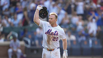 Sep 14, 2025; New York City, New York, USA; New York Mets first baseman Pete Alonso (20) throws his helmet after hitting a walk off three run home run against the Texas Rangers during the tenth inning at Citi Field. Mandatory Credit: Gregory Fisher-Imagn Images