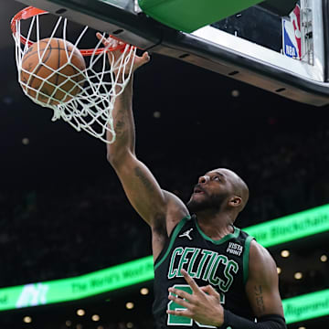 Mar 1, 2024; Boston, Massachusetts, USA; Boston Celtics forward Xavier Tillman (26) makes the basket against the Dallas Mavericks in the second half at TD Garden. Mandatory Credit: David Butler II-Imagn Images