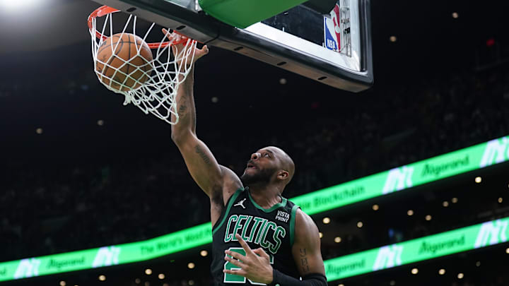 Mar 1, 2024; Boston, Massachusetts, USA; Boston Celtics forward Xavier Tillman (26) makes the basket against the Dallas Mavericks in the second half at TD Garden. Mandatory Credit: David Butler II-Imagn Images