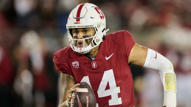 Stanford Cardinal quarterback Ashton Daniels on a rushing attempt during a college football game.