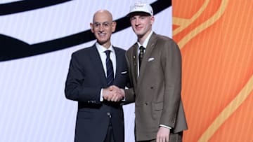 Jun 25, 2025; Brooklyn, NY, USA;  Kasparas Jakucionis stands with NBA commissioner Adam Silver after being selected as the 20th pick by the Miami Heat in the first round of the 2025 NBA Draft at Barclays Center. Mandatory Credit: Brad Penner-Imagn Images