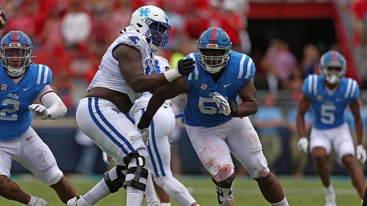 Sep 28, 2024; Oxford, Mississippi, USA; Mississippi Rebels defensive linemen Zxavian Harris (51) rushes as Kentucky Wildcats offensive lineman Jalen Farmer (52) blocks during the first half at Vaught-Hemingway Stadium. Mandatory Credit: Petre Thomas-Imagn Images