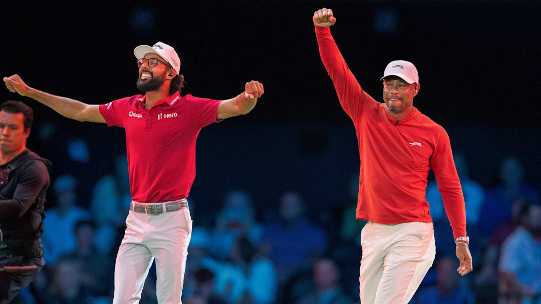 Tiger Woods and Akshay Bhatia of Jupiter Links GC celebrate the win over Boston Common Golf during TGL match at SoFi Center on March 17, 2026, in Palm Beach Gardens, Florida.