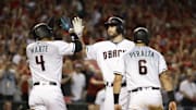 Oct 4, 2017; Phoenix, AZ, USA; Arizona Diamondbacks first baseman Paul Goldschmidt (middle) reacts after hitting a three-run home run to drive in shortstop Ketel Marte (4) and outfielder David Peralta (6) against the Colorado Rockies in the first inning of the 2017 National League wildcard playoff baseball game at Chase Field. Mandatory Credit: Rob Schumacher/The Arizona Republic via USA TODAY NETWORK