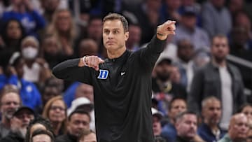 Nov 12, 2024; Atlanta, Georgia, USA; Duke basketball head coach Jon Scheyer reacts on the sideline against the Kentucky Wildcats during the second half at State Farm Arena
