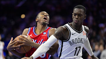 Nov 22, 2024; Philadelphia, Pennsylvania, USA; Philadelphia 76ers guard Tyrese Maxey (0) drives against Brooklyn Nets guard Dennis Schroder (17) during the fourth quarter at Wells Fargo Center. Mandatory Credit: Bill Streicher-Imagn Images