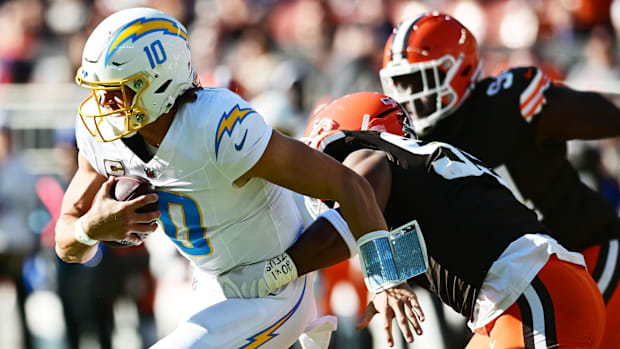 Cleveland Browns defensive end Myles Garrett (95) sacks Los Angeles Chargers quarterback Justin Herbert (10) during the first