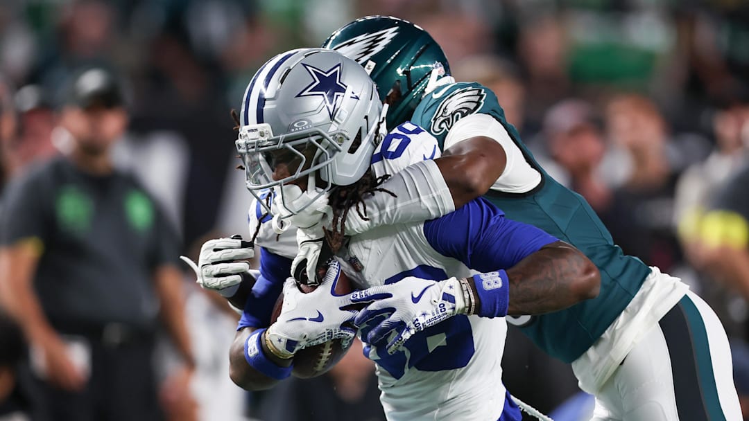 Sep 4, 2025; Philadelphia, Pennsylvania, USA; Philadelphia Eagles cornerback Adoree' Jackson (8) tackles Dallas Cowboys wide receiver CeeDee Lamb (88) during the first quarter of the game at Lincoln Financial Field. Mandatory Credit: Bill Streicher-Imagn Images