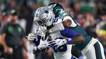 Sep 4, 2025; Philadelphia, Pennsylvania, USA; Philadelphia Eagles cornerback Adoree' Jackson (8) tackles Dallas Cowboys wide receiver CeeDee Lamb (88) during the first quarter of the game at Lincoln Financial Field. Mandatory Credit: Bill Streicher-Imagn Images