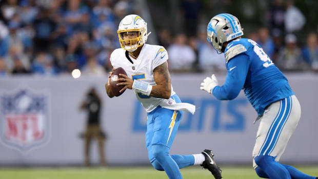 Trey Lance looks to pass against the Lions in the Hall of Fame Game.