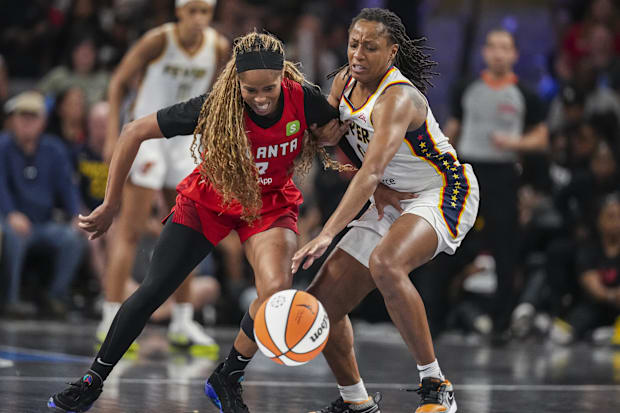 Indiana Fever guard Kelsey Mitchell (0) steals the ball from Atlanta Dream guard Jordin Canada (3)