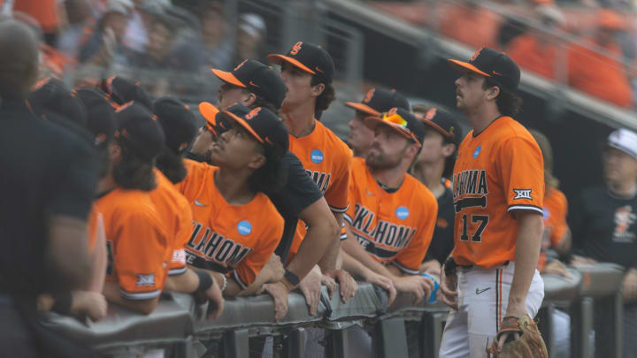 Jun 3, 2024; Stillwater, OK, USA; Oklahoma State infielder Tyler Wulfert (17) watches a foul ball with the dugout during a NCAA regional baseball game against Florida at O'Brate Stadium. Mandatory Credit: Mitch Alcala-The Oklahoman
