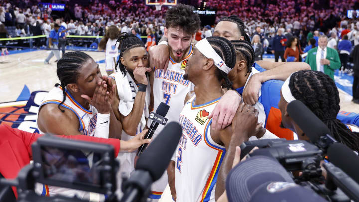 Apr 21, 2024; Oklahoma City, Oklahoma, USA; Oklahoma City Thunder guard Shai Gilgeous-Alexander (2) is met by his teammates during an interview with tv after defeating the New Orleans Pelicans in game one of the first round for the 2024 NBA playoffs at Paycom Center. Mandatory Credit: Alonzo Adams-USA TODAY Sports