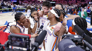 Apr 21, 2024; Oklahoma City, Oklahoma, USA; Oklahoma City Thunder guard Shai Gilgeous-Alexander (2) is met by his teammates during an interview with tv after defeating the New Orleans Pelicans in game one of the first round for the 2024 NBA playoffs at Paycom Center. Mandatory Credit: Alonzo Adams-Imagn Images