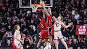 Feb 5, 2025; Piscataway, New Jersey, USA; Rutgers Scarlet Knights guard Ace Bailey (4) and guard Dylan Harper (2) rebound against Illinois Fighting Illini guard Kasparas Jakucionis (32) during the second half at Jersey Mike's Arena. Mandatory Credit: Vincent Carchietta-Imagn Images