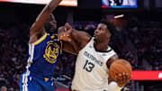 Jan 4, 2025; San Francisco, California, USA;  Memphis Grizzlies forward/center Jaren Jackson Jr. (13) drives to the basket against Golden State Warriors forward Draymond Green (23) in the third quarter at Chase Center. Mandatory Credit: David Gonzales-Imagn Images