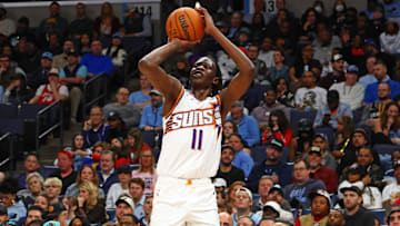 Feb 25, 2025; Memphis, Tennessee, USA; Phoenix Suns center Bol Bol (11) shoots for three during the third quarter against the Memphis Grizzlies at FedExForum. Mandatory Credit: Petre Thomas-Imagn Images