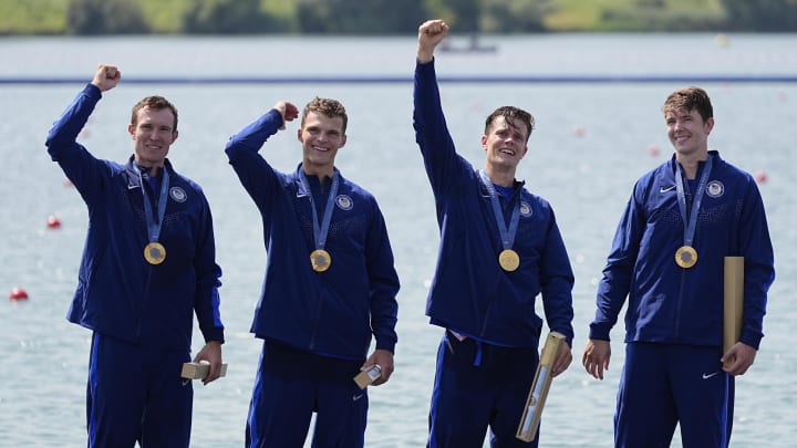 Nick Mead, Justin Best, Michael Grady and Liam Corrigan celebrate their gold medal in the men's four during the Paris 2024 Olympic Summer Games at Vaires-sur-Marne Nautical Stadium.