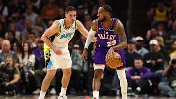 Dec 19, 2024; Phoenix, Arizona, USA; Phoenix Suns guard Monte Morris (23) against Indiana Pacers guard T.J. McConnell (9) at Footprint Center. Mandatory Credit: Mark J. Rebilas-Imagn Images