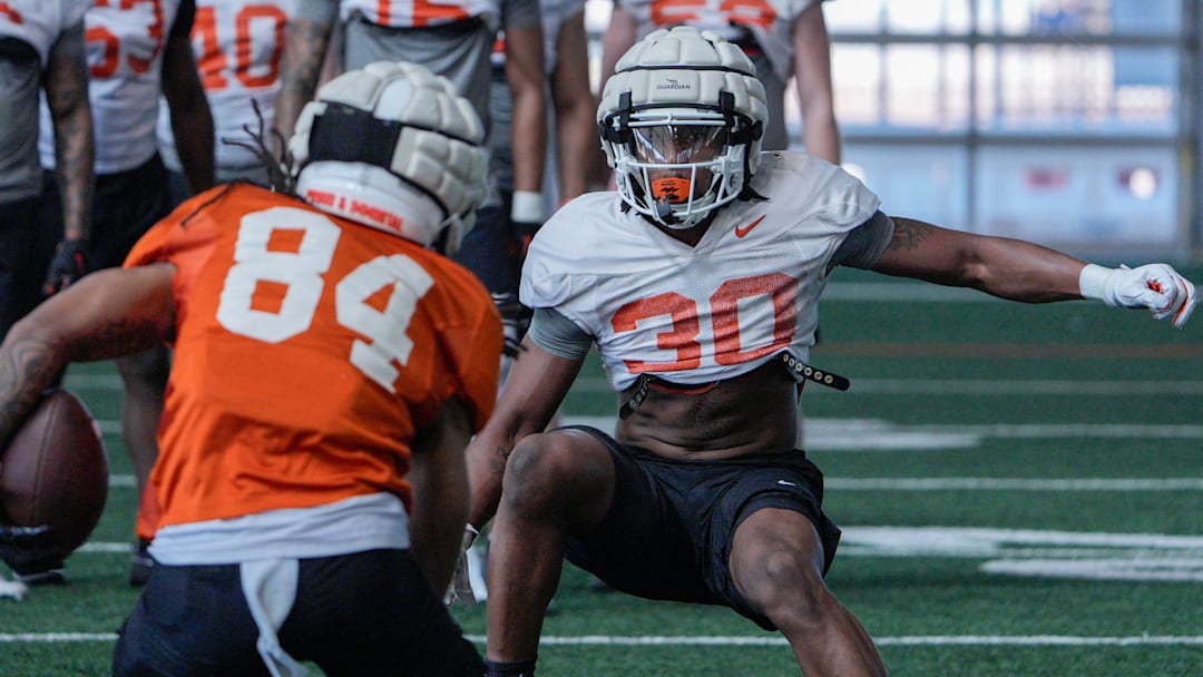 Oklahoma State linebacker Trip White prepares to make a tackle during a drill. 