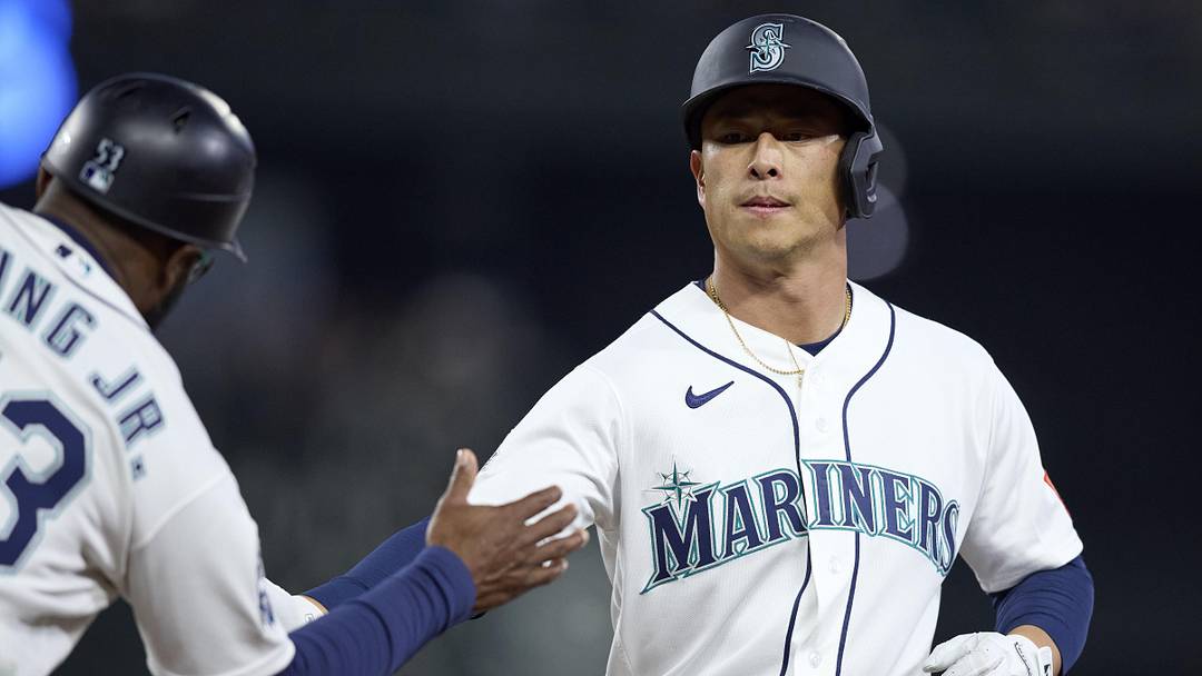 Apr 21, 2026; Seattle, Washington, USA; Seattle Mariners right fielder Rob Refsnyder (30) is greeted on first after a single against the Athletics during the third inning at T-Mobile Park. Mandatory Credit: John Froschauer-Imagn Images Apr 21, 2026; Seattle, Washington, USA; Seattle Mariners right fielder Rob Refsnyder (30) is greeted on first after a single against the Athletics during the third inning at T-Mobile Park. Mandatory Credit: John Froschauer-Imagn Images