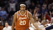Mar 19, 2025; Dayton, OH, USA; Texas Longhorns guard Tre Johnson (20) high fives Xavier Musketeers head coach Sean Miller after making a three point basket in the second half at UD Arena. Mandatory Credit: Rick Osentoski-Imagn Images