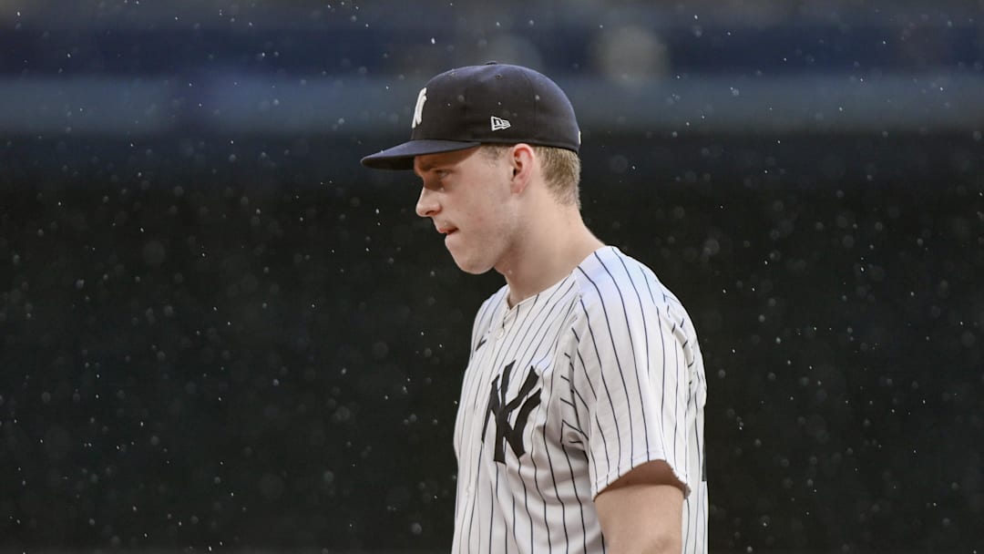 Sep 6, 2025; Bronx, New York, USA; New York Yankees first baseman Ben Rice (22) looks on as a steady rain begins to fall during the sixth inning against the Toronto Blue Jays at Yankee Stadium. Mandatory Credit: John Jones-Imagn Images