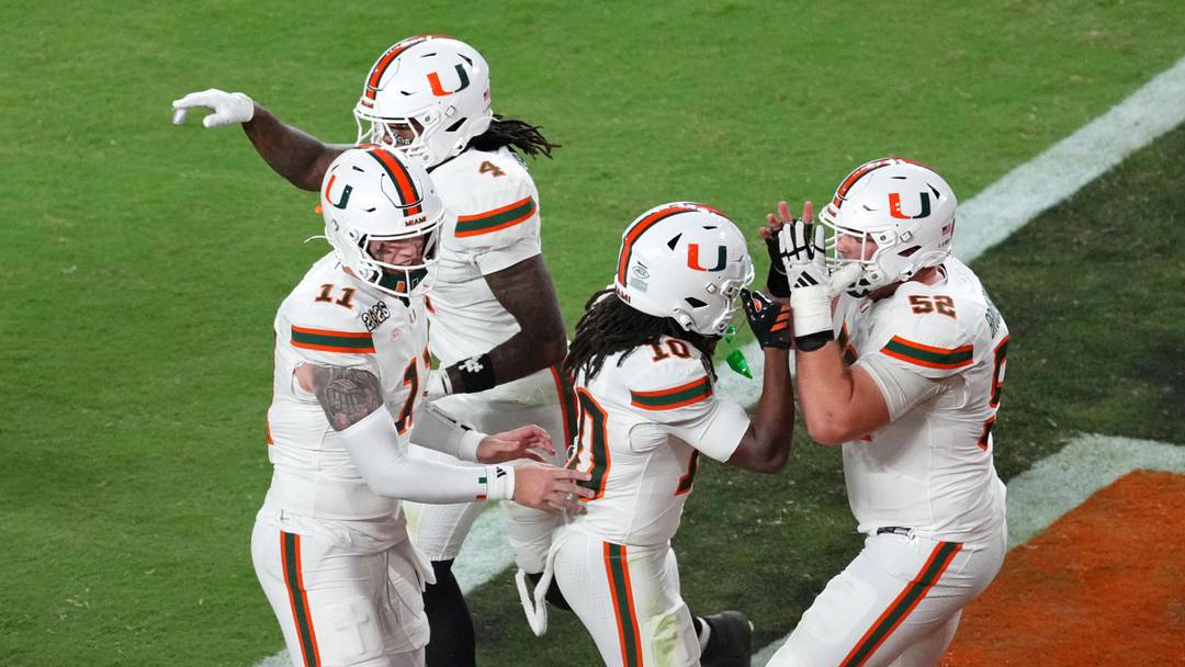 Jan 19, 2026; Miami Gardens, FL, USA; Miami Hurricanes wide receiver Malachi Toney (10) celebrates with offensive lineman James Brockermeyer (52) after scoring a touchdown against the Indiana Hoosiers during the second half of the College Football Playoff National Championship game at Hard Rock Stadium. Mandatory Credit: James Lang-Imagn Images Jan 19, 2026; Miami Gardens, FL, USA; Miami Hurricanes wide receiver Malachi Toney (10) celebrates with offensive lineman James Brockermeyer (52) after scoring a touchdown against the Indiana Hoosiers during the second half of the College Football Playoff National Championship game at Hard Rock Stadium. Mandatory Credit: James Lang-Imagn Images