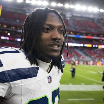 Dec 8, 2024; Glendale, Arizona, USA; Seattle Seahawks cornerback Riq Woolen (27) against the Arizona Cardinals at State Farm Stadium.