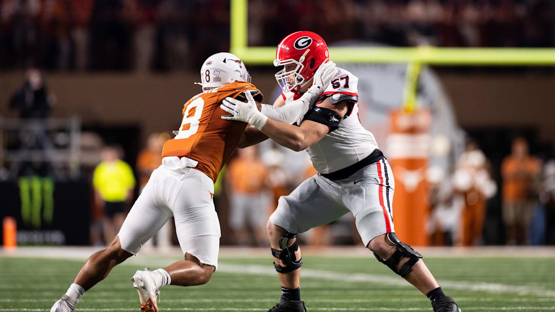 Oct 19, 2024; Austin, Texas, USA; Georgia Bulldogs offensive lineman Monroe Freeling (57) blocks Texas Longhorns edge rusher Trey Moore (8) in the second quarter at Darrell K Royal-Texas Memorial Stadium. Mandatory Credit: Brett Patzke-Imagn Images