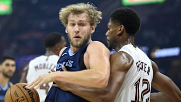 Memphis Grizzlies center Jock Landale works to the basket beside Cleveland Cavaliers forward De'Andre Hunter.