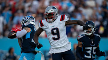 Tennessee Titans safety Amani Hooker intercepts a pass intended for New England Patriots wide receiver Kayshon Boutte