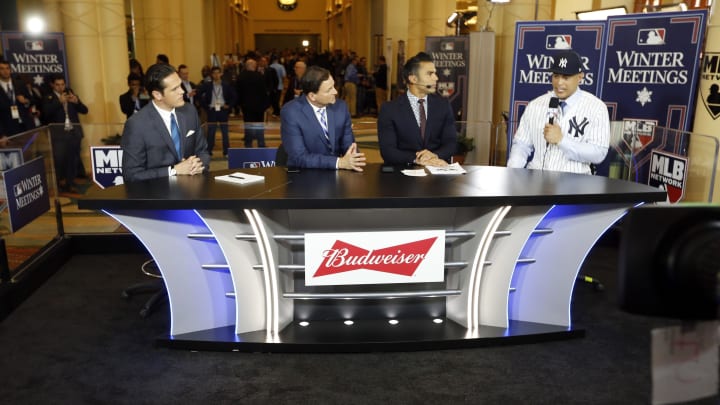 Dec 11, 2017; Orlando, FL, USA; New York Yankees outfielder Giancarlo Stanton (27)  talks with MLB Network host Greg Amsinger, analyst Dan Plesac and analyst Carlos Pena at Walt Disney World Swan and Dolphin Resort. Mandatory Credit: Kim Klement-USA TODAY Sports