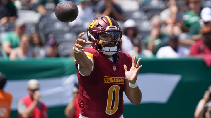 Aug 10, 2024; East Rutherford, New Jersey, USA; Washington Commanders quarterback Marcus Mariota (0) passes during the first quarter against the New York Jets at MetLife Stadium. Mandatory Credit: Lucas Boland-USA TODAY Sports