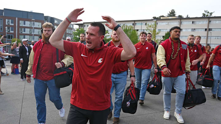 Sep 7, 2024; Pullman, Washington, USA; Washington State Cougars head coach Jake Dickert leads his team into Gesa Field at Martin Stadium for a game against the Texas Tech Red Raiders. Mandatory Credit: James Snook-Imagn Images