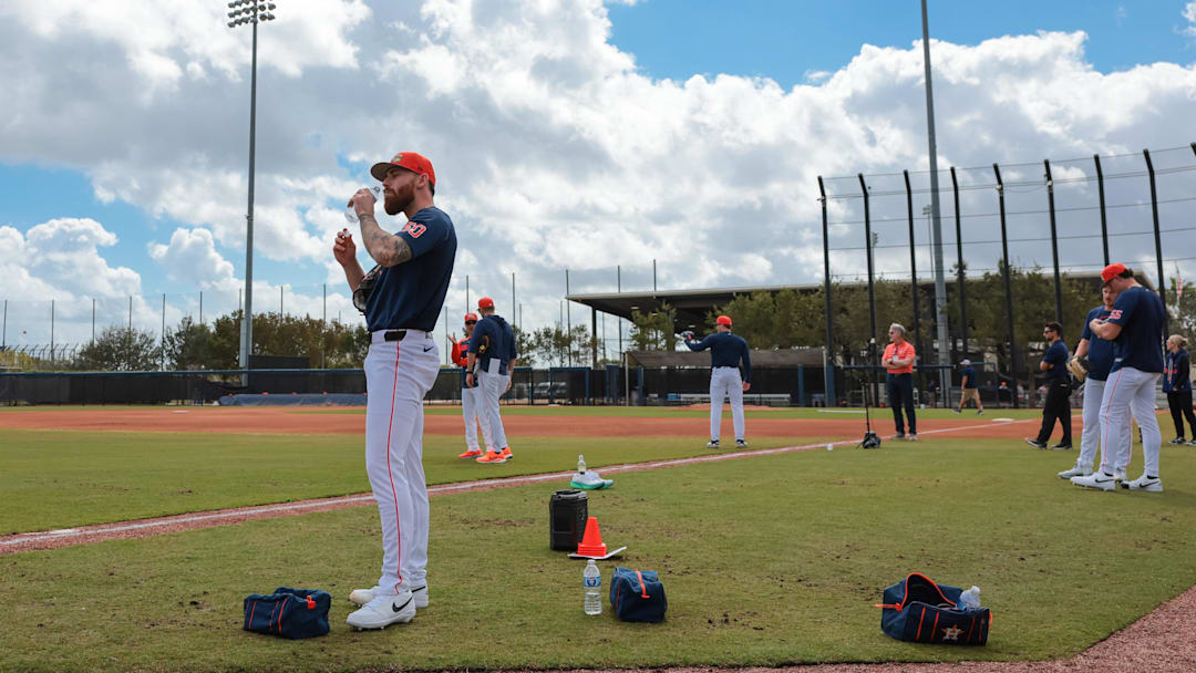 Feb 15, 2026; West Palm Beach, FL, USA; Houston Astros. Pitcher Mike Burrows (50) hydrates during spring training at CACTI Park of The Palm Beaches.  Mandatory Credit: Sam Navarro-Imagn Images