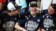 Apr 6, 2025; Tampa, FL, USA; Connecticut Huskies guard Kaitlyn Chen (20) and guard Paige Bueckers (5) celebrates after winning the national championship of the women's 2025 NCAA tournament against the South Carolina Gamecocks at Amalie Arena. Mandatory Credit: Nathan Ray Seebeck-Imagn Images