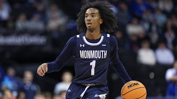 Monmouth Hawks guard Abdi Bashir Jr. (1) dribbles up court during the first half against the Seton Hall Pirates