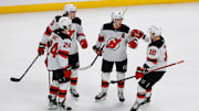 Feb 26, 2025; Denver, Colorado, USA; New Jersey Devils center Jack Hughes (86) celebrates his goal with defenseman Luke Hughes (43) and defenseman Seamus Casey (24) and left wing Ondrej Palat (18) in the third period against the Colorado Avalanche at Ball Arena. Mandatory Credit: Isaiah J. Downing-Imagn Images