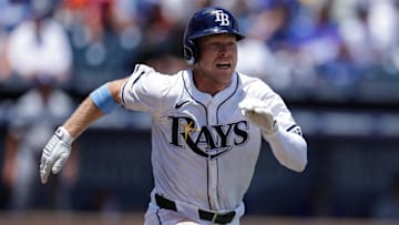Aug 3, 2025; Tampa, Florida, USA; Tampa Bay Rays shortstop Taylor Walls (6) singles against the Los Angeles Dodgers in the fifth inning at George M. Steinbrenner Field. 